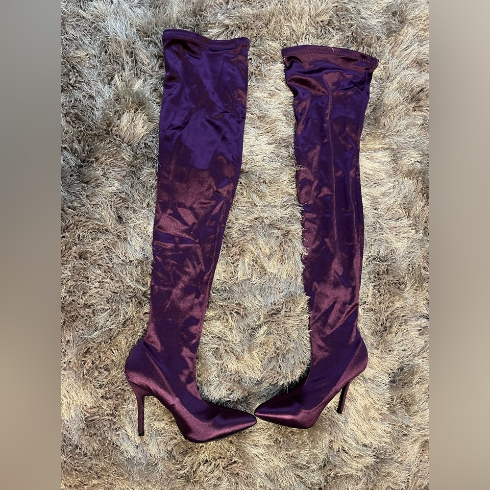 Thigh high purple heeled boots